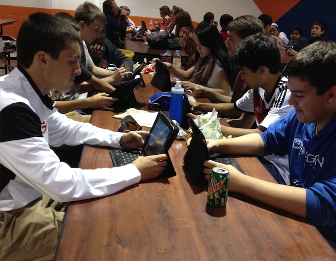 Students work on iPads during lunch periods.