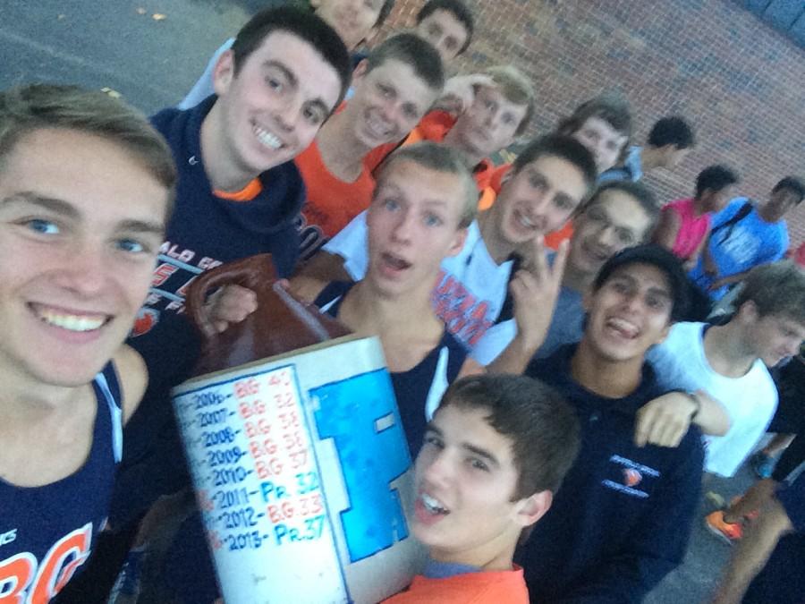 Cross country team wins the MSL East Division and celebrates with a selfie. 