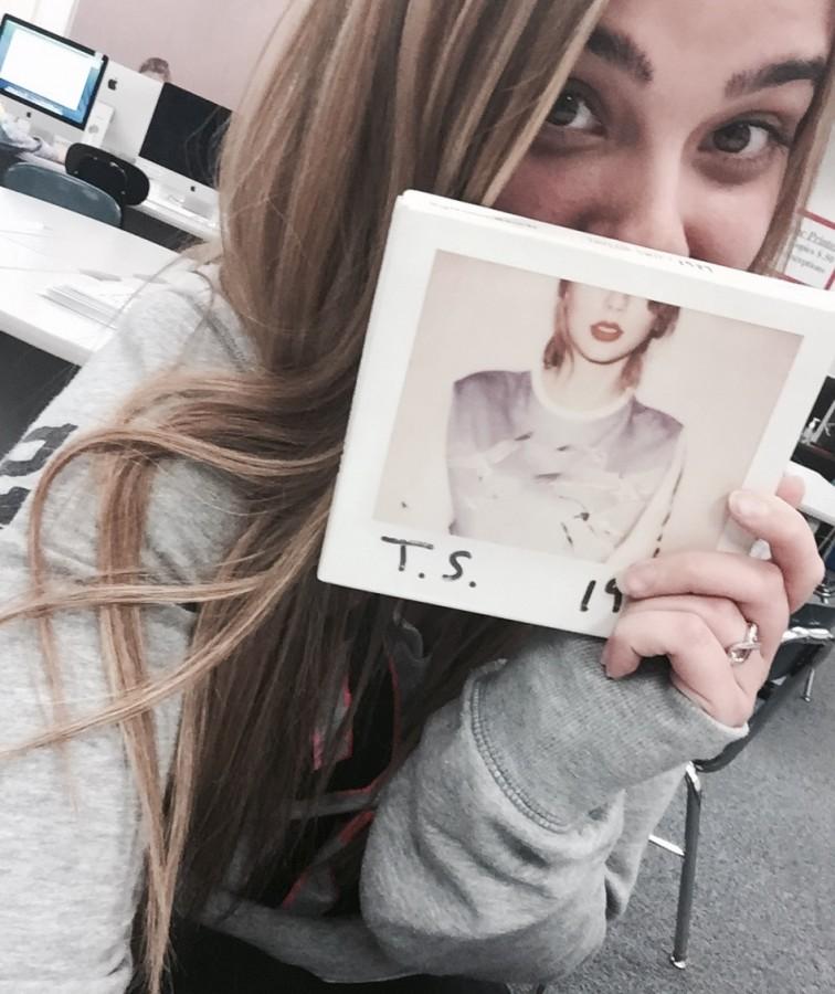 Nicole Bankowski takes Swift's requested selfie with the album.