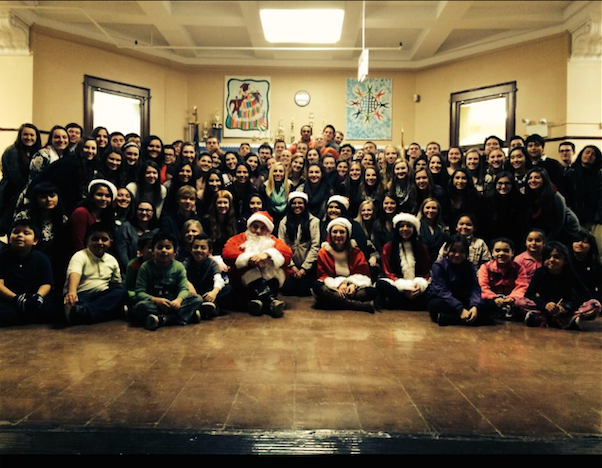 Sociology students pose with children from Armoure Elementary School.