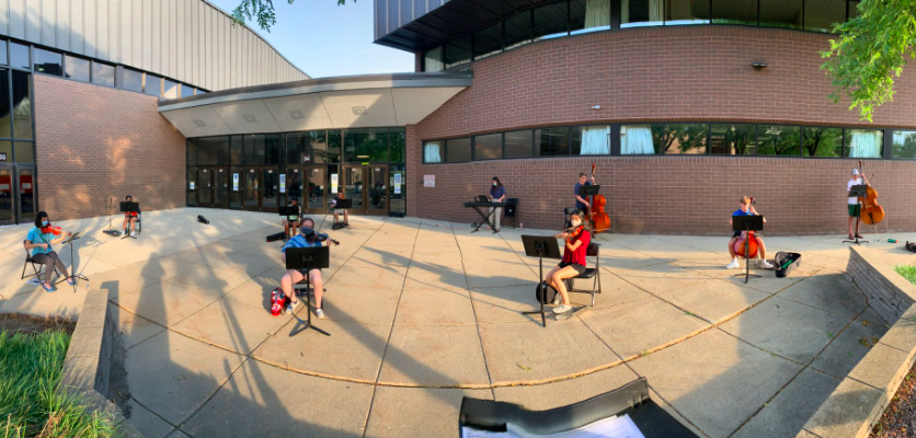 BG Orchestra members practice at a socially distant outdoor rehearsal near the circle drive.