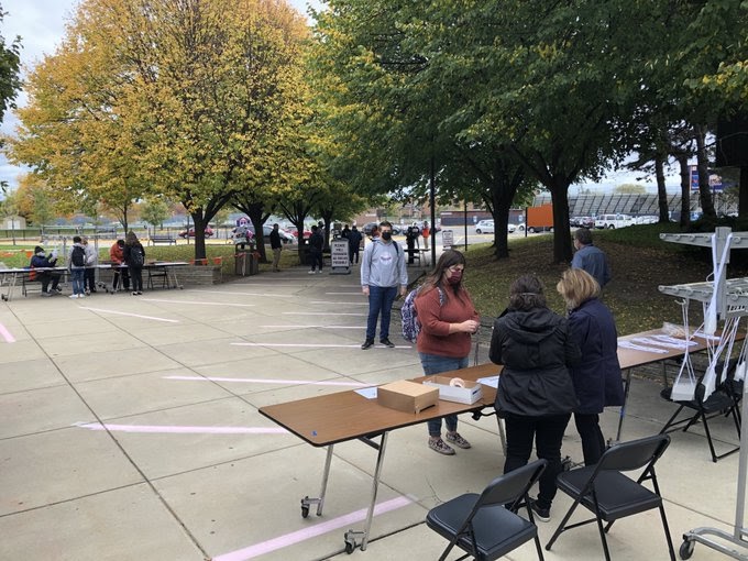 Students line up to attend the first day of in-person learning.