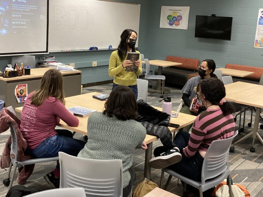 Christine Yuan talks to the Book Club members about the book she is currently reading. 